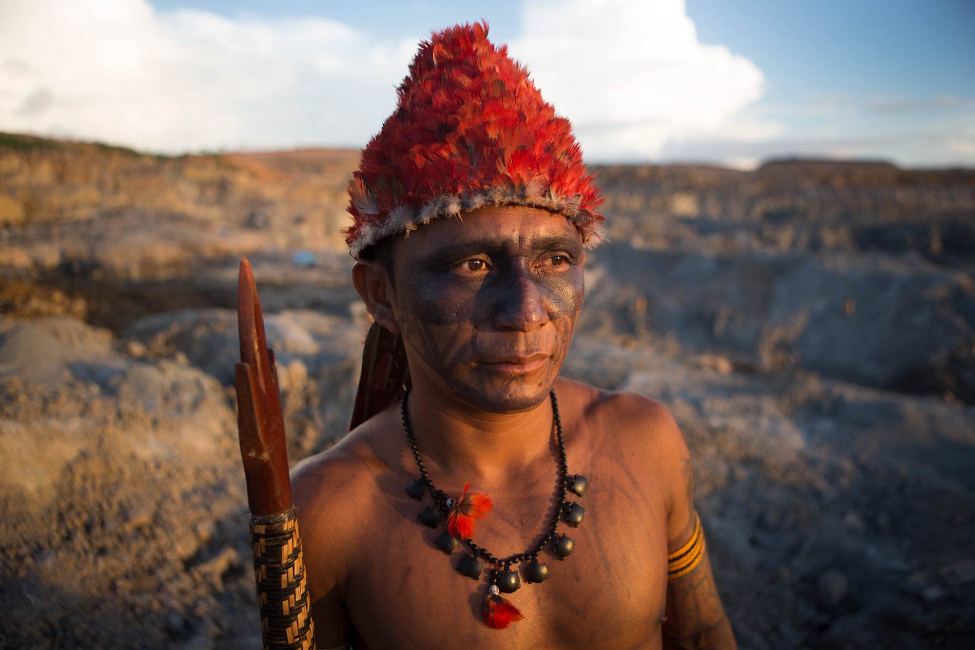 An indigenous Munduruku man surveys the quarry site for the Belo Monte Dam.